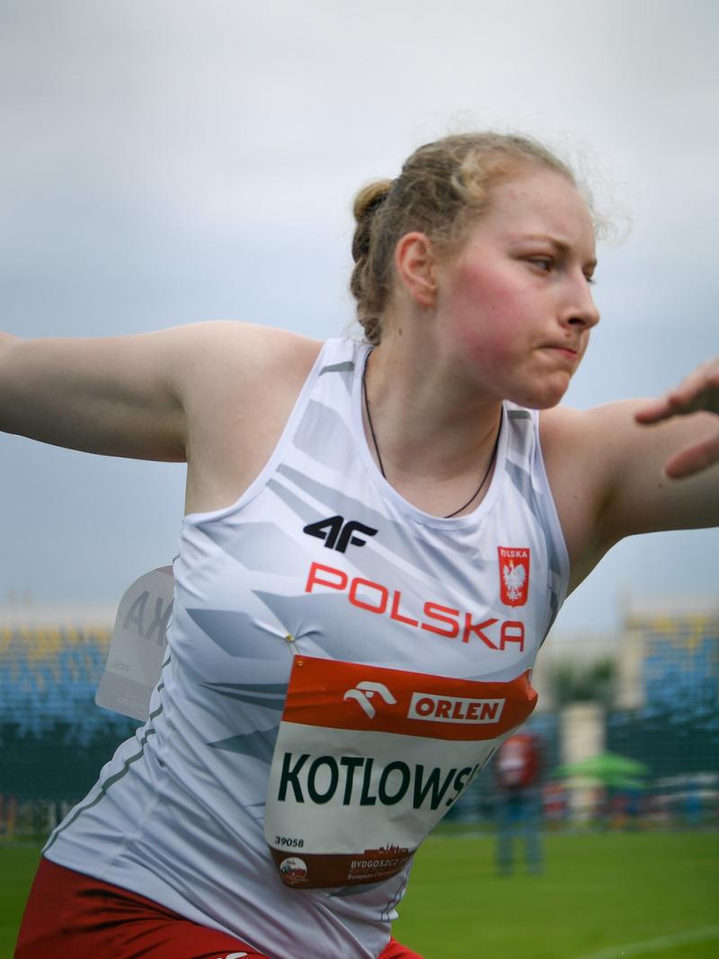 A woman competing in the discus throw in an athletics event