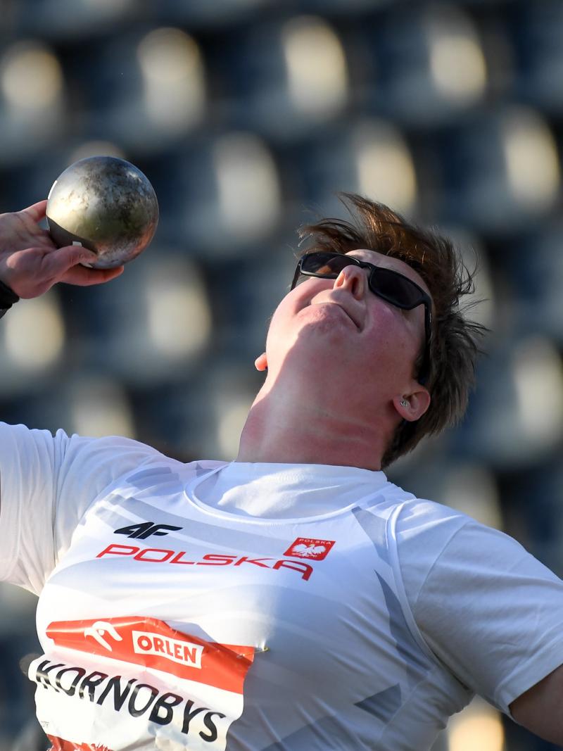 A woman competing in shot put 