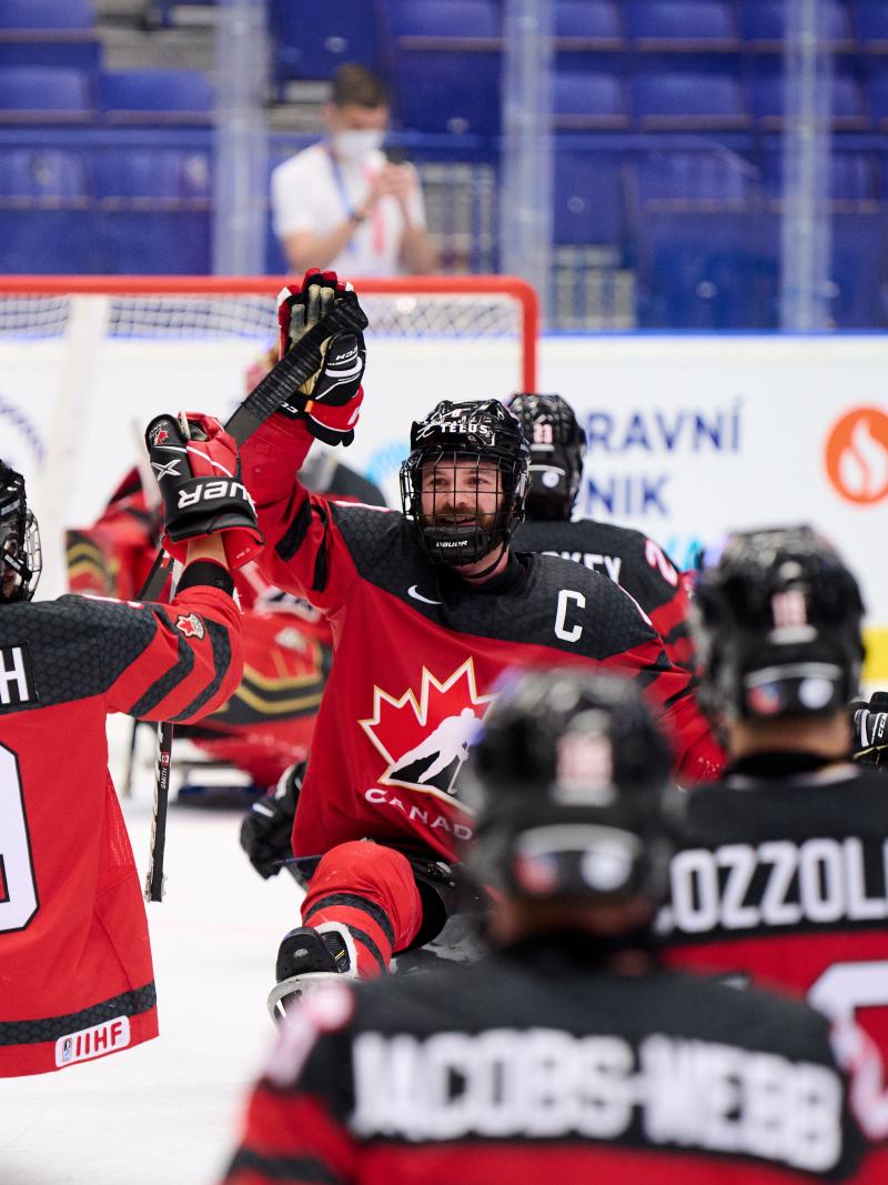 A group of Canadian Para ice hockey players celebrating