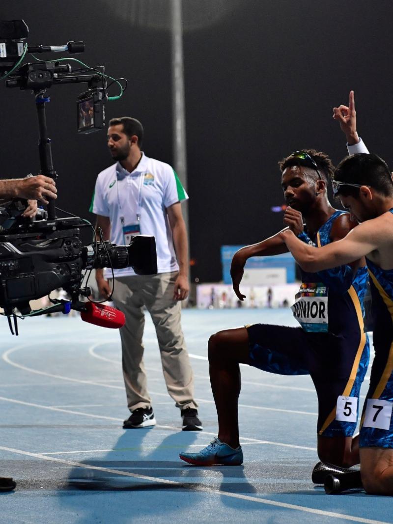 Brazilian track team on the track posing for the camera