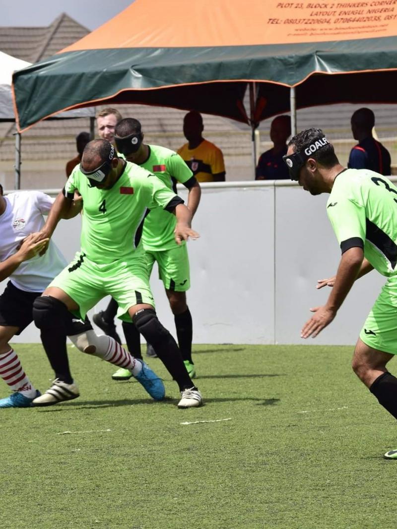 Moroccan and Egyptian football 5-a-side players fighting for the ball