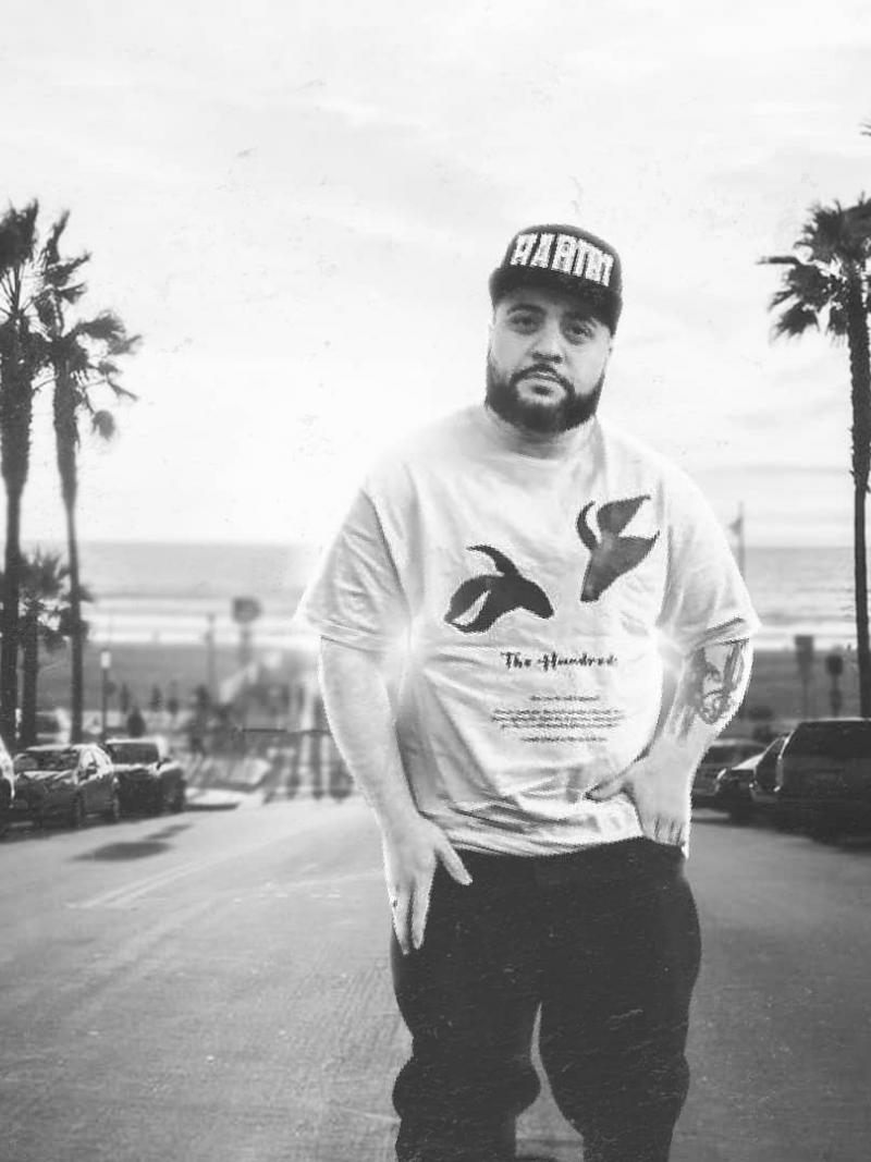 Male rapper poses in black and white photo