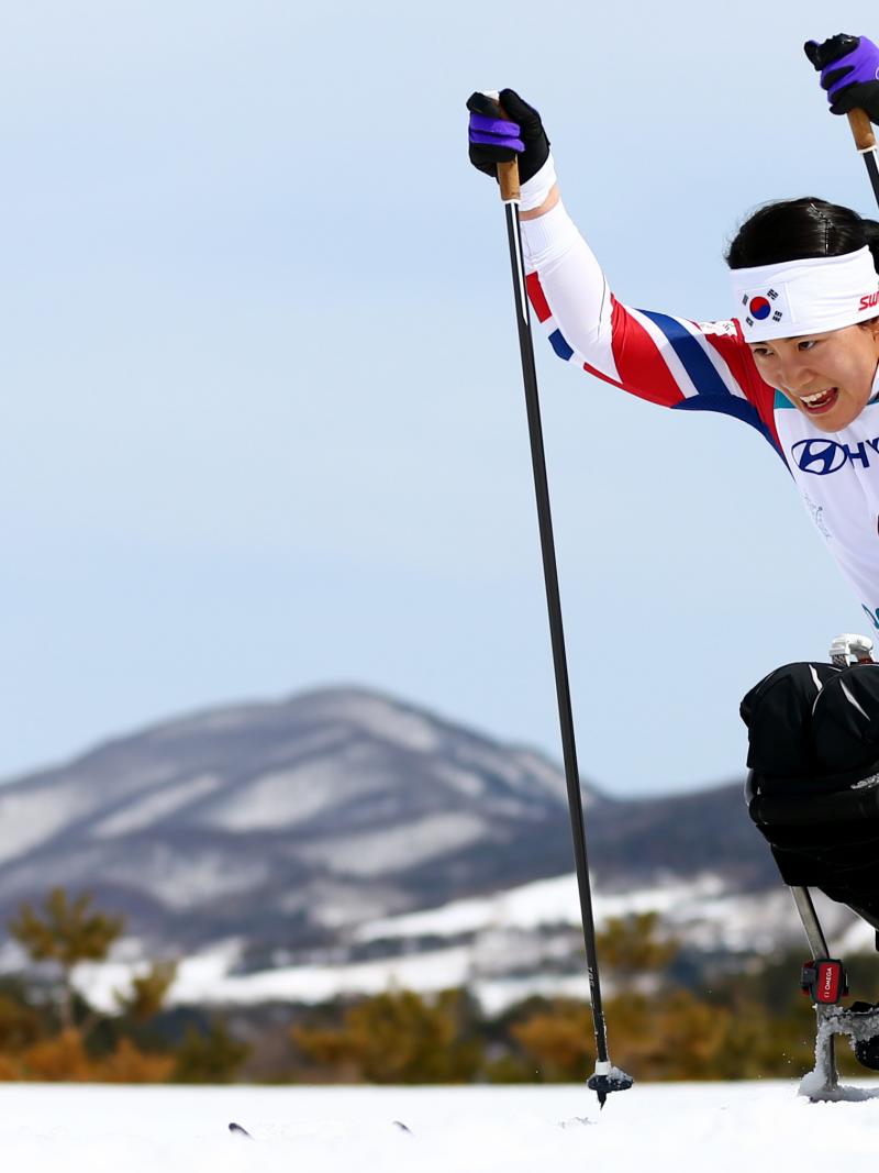 A female sit-skier in a Para cross-country competition