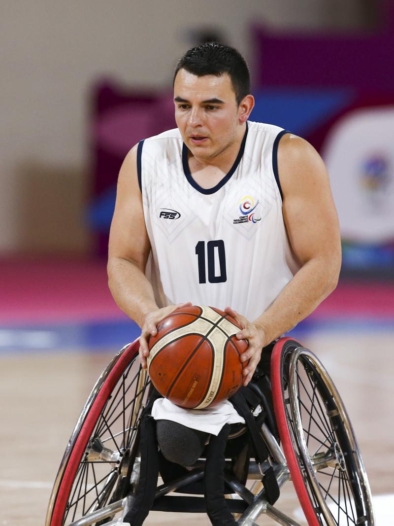 Colombian wheelchair basketball player Jose Leep focused with the ball in his hands
