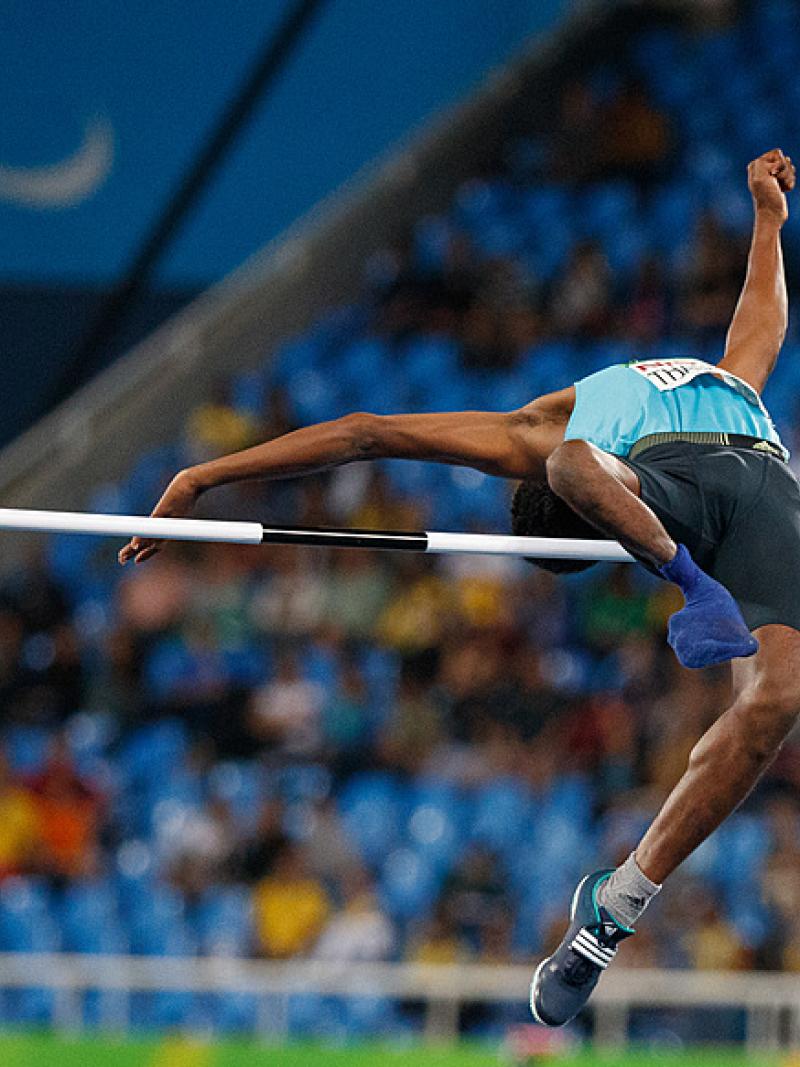 A man competing in the high jump 