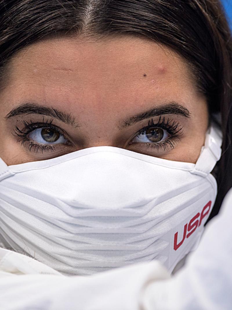 Close up of Anastasia Pagonis of USA brown eyes, brown hair and white USA mask
