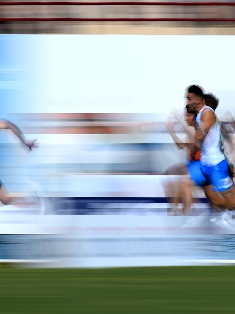 A man ahead of his competitors in an athletics race