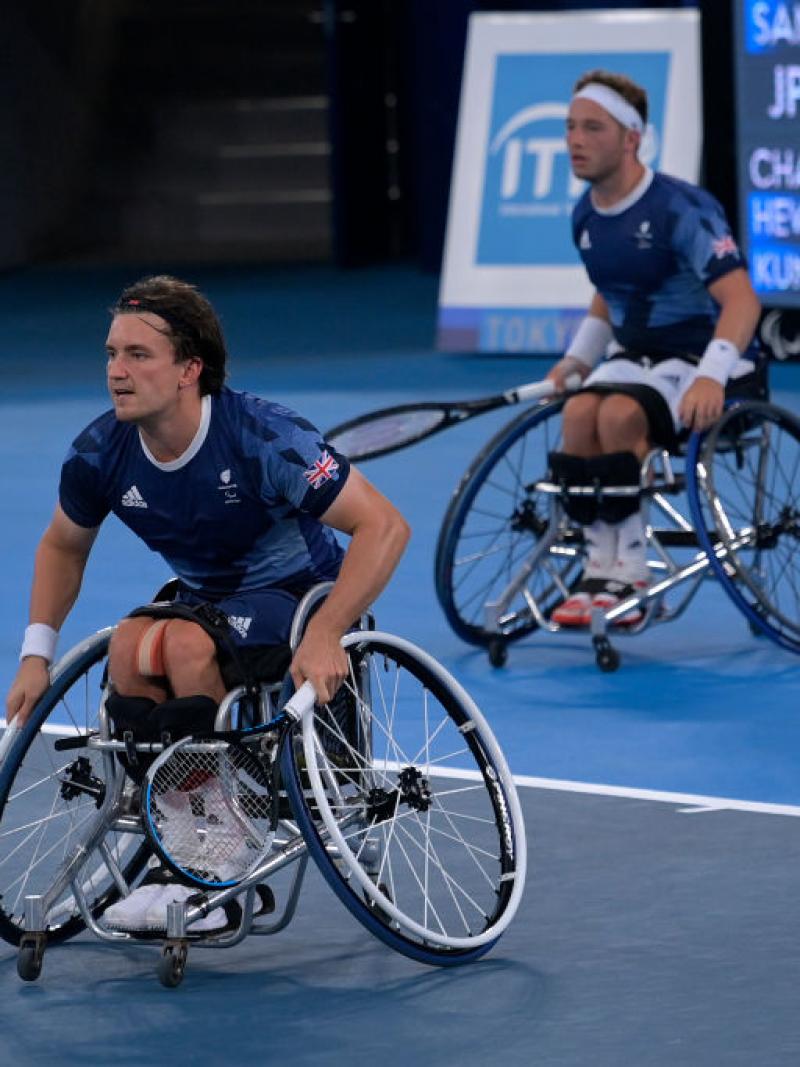 Gordon Reid in action with Alfie Hewett just behind him