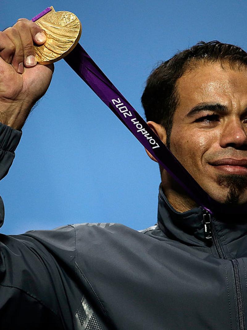 Sherif Osman holds up his London 2012 gold medal