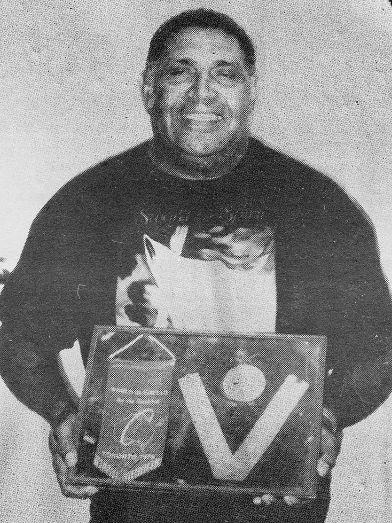 File photo of Harry Mosby with his medal from Toronto Games.