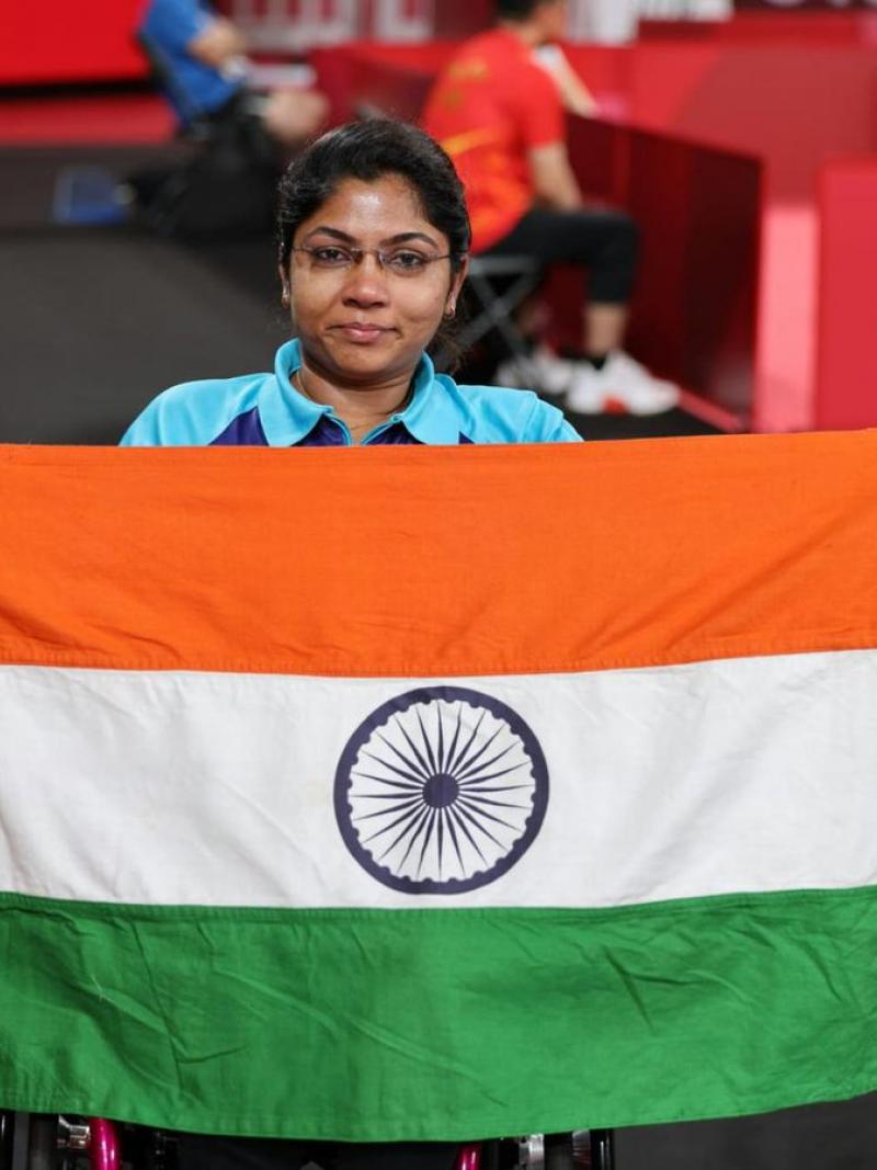 Bhavinaben Patel poses with the Indian flag after her historical performance