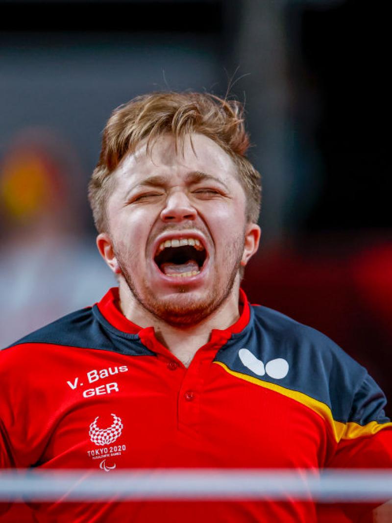 German male table tennis player celebrates