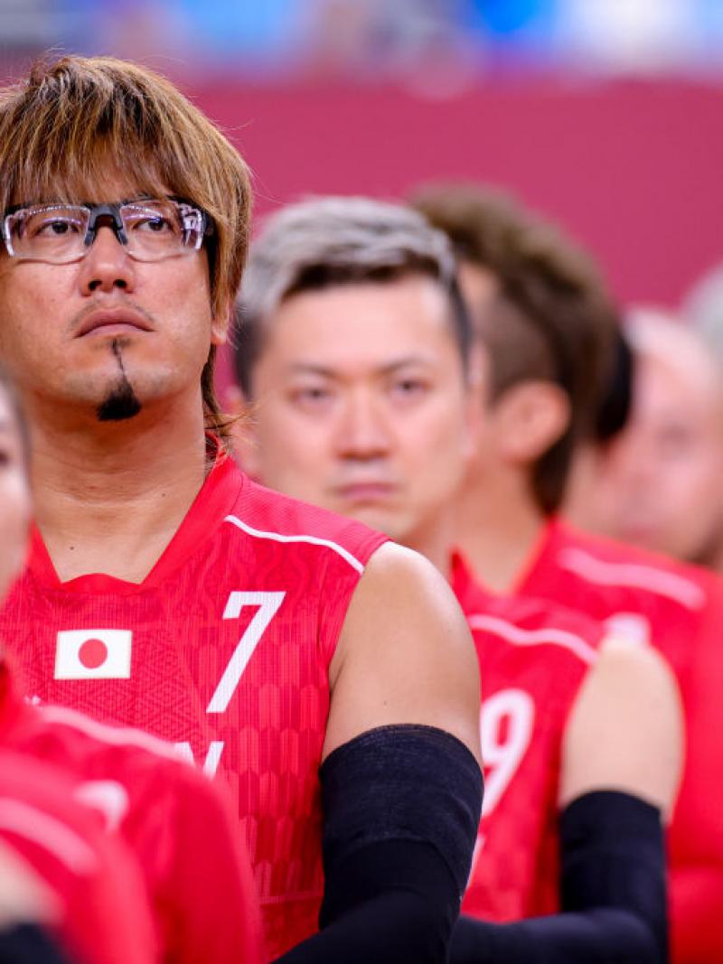Japanese male wheelchair rugby player and his team line up for the anthem