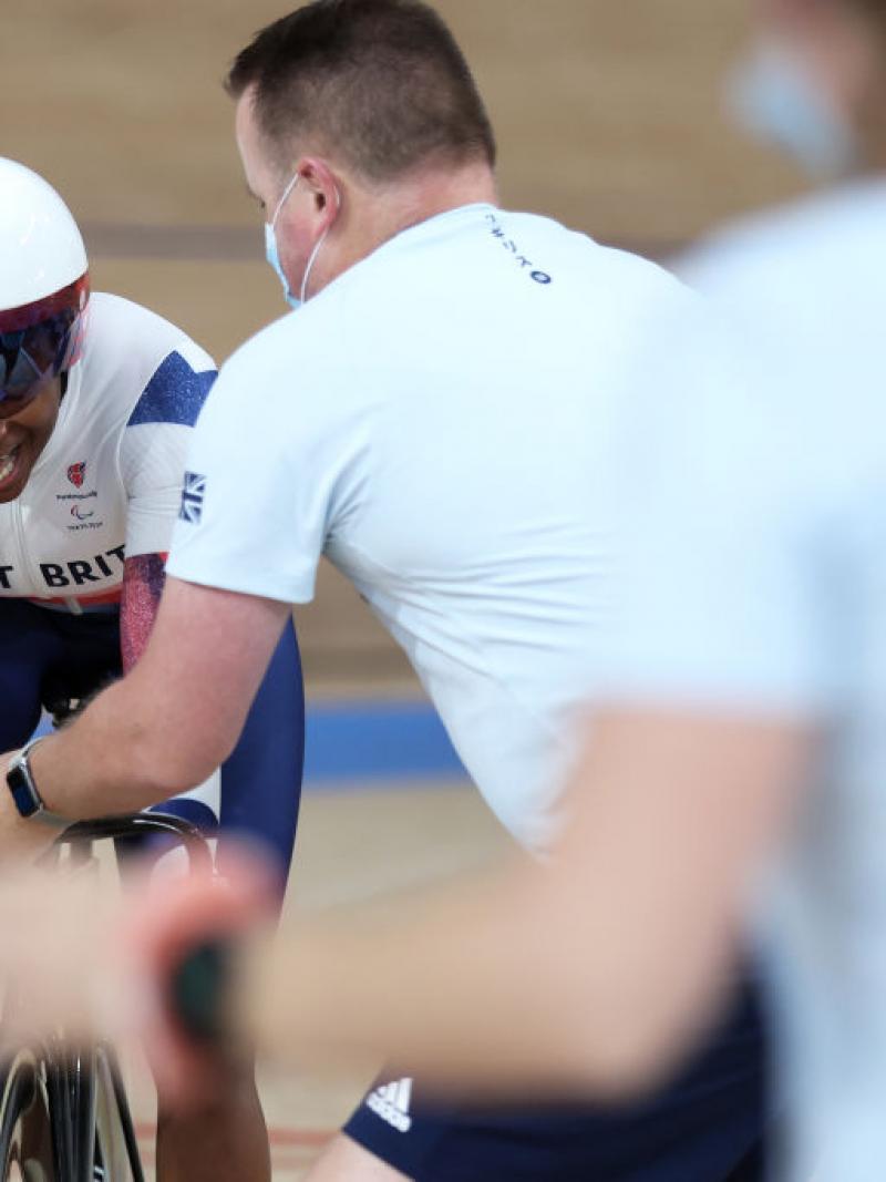 Woman on track cycle pushes to win