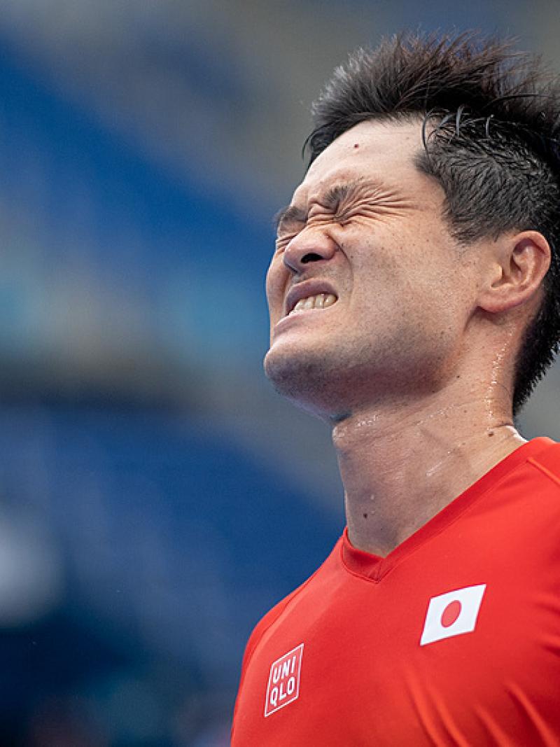 Kunieda grimaces in a close-up shot of his head and shoulders