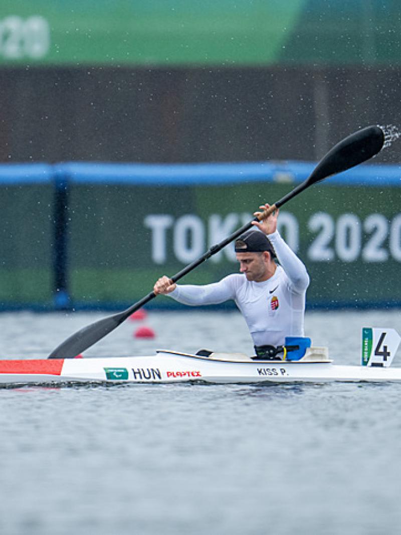 Peter Pal Kiss splashes water up in a strong stroke in his kayak