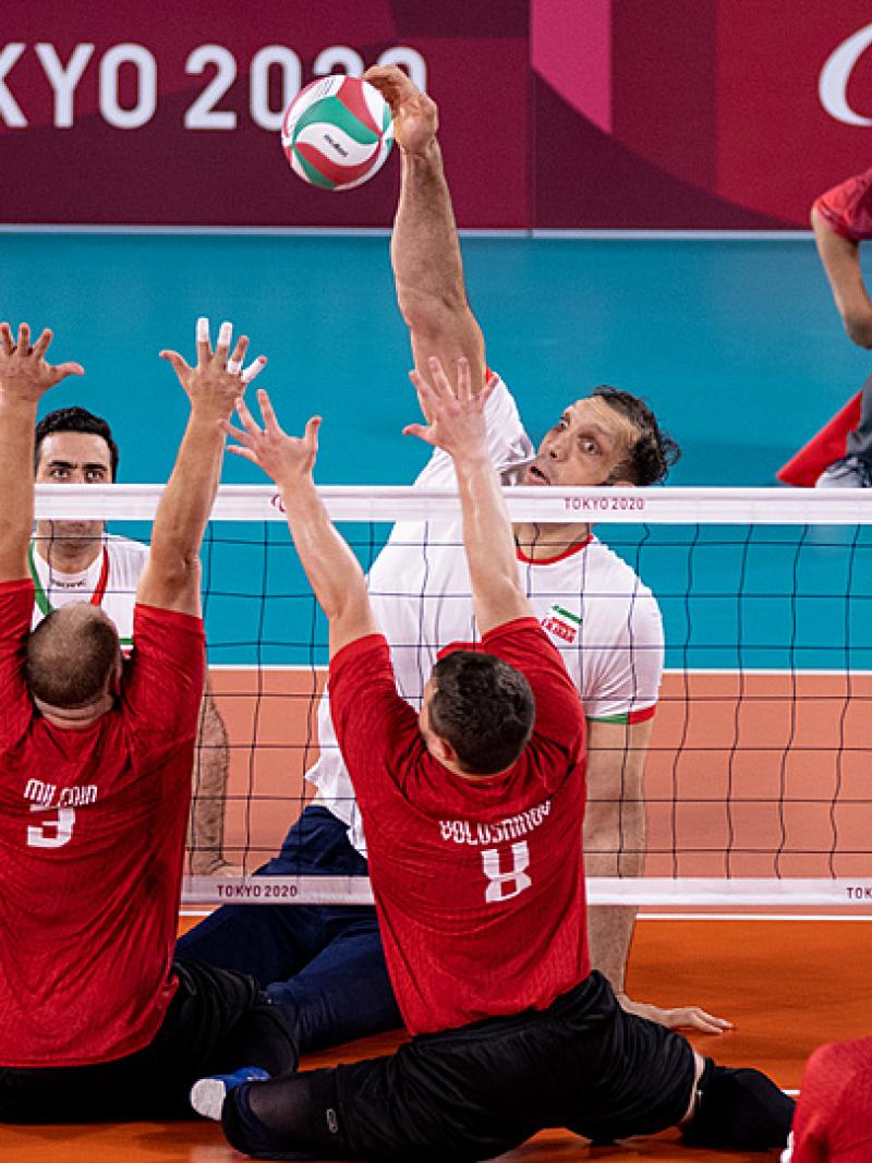 Iran's Morteza Mehrzadselakjani spikes the ball in a sitting volleyball game