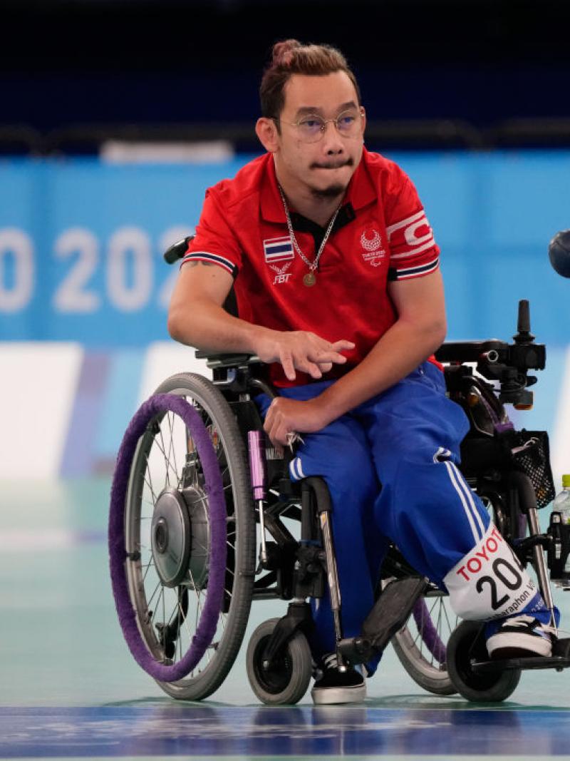 Watcharaphon Vongsa bites his lip in concentration as he throw the boccia ball