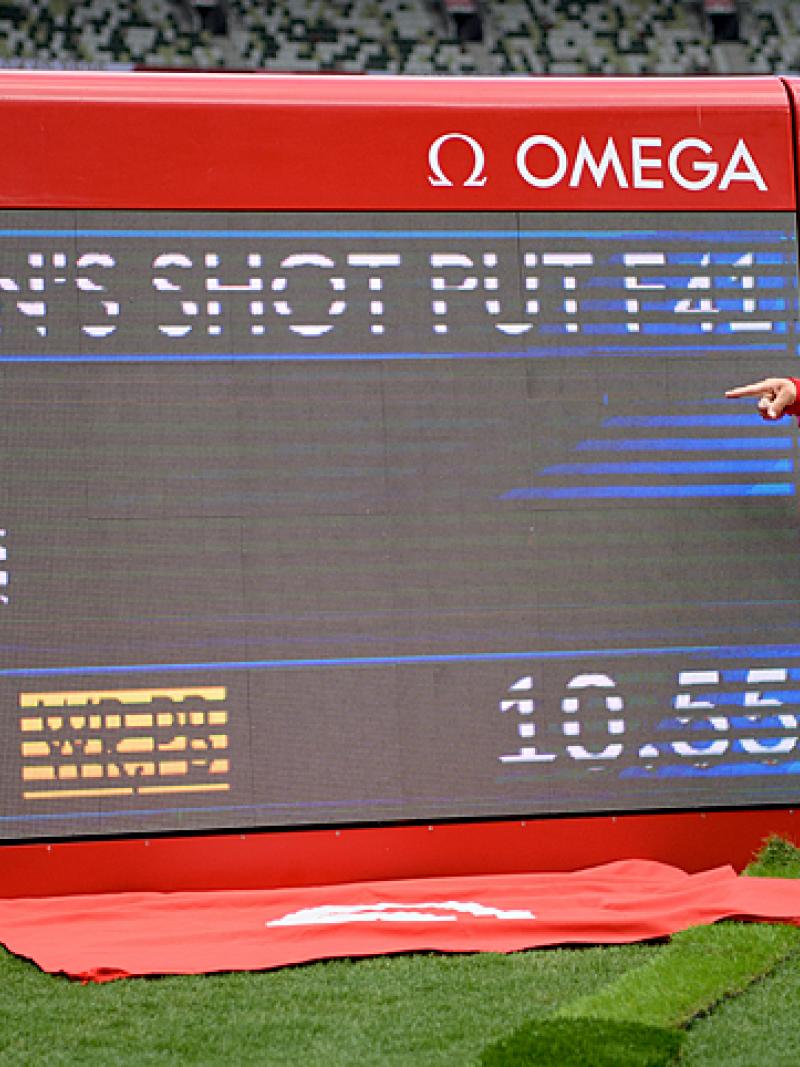 THE CHAMP: Raoua Tlili of Tunisia poses next to the digital scoreboard showing her World record in the women's shot put F41 at Tokyo 2020 Paralympic Games. 
