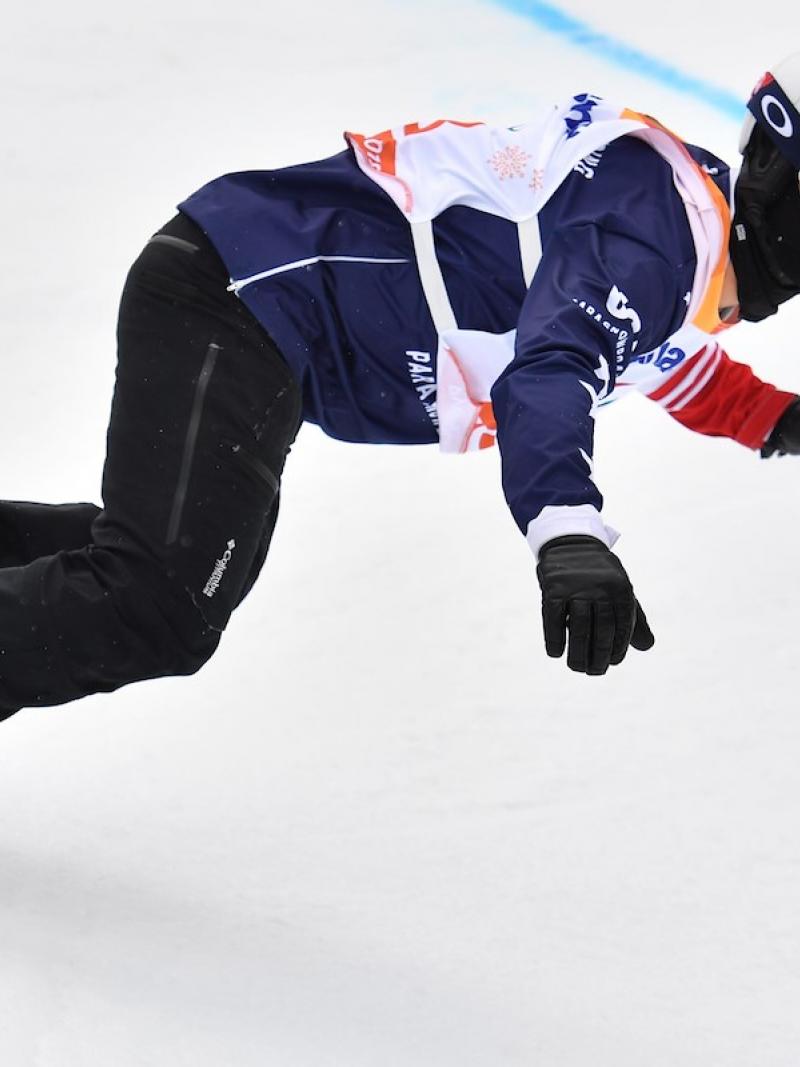 A male Para snowboarder competing