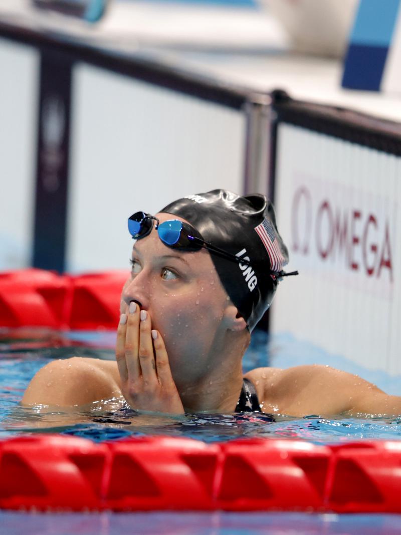 A female swimmer with a surprised expression in the pool