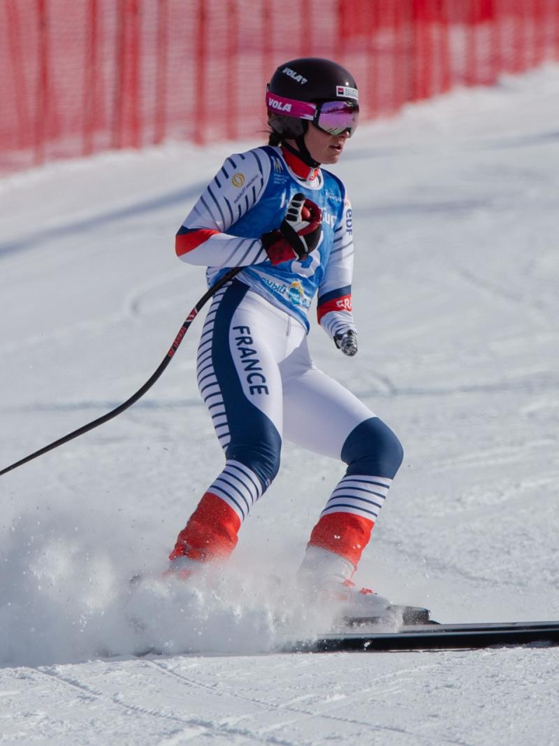 A female skier on a ski slope 