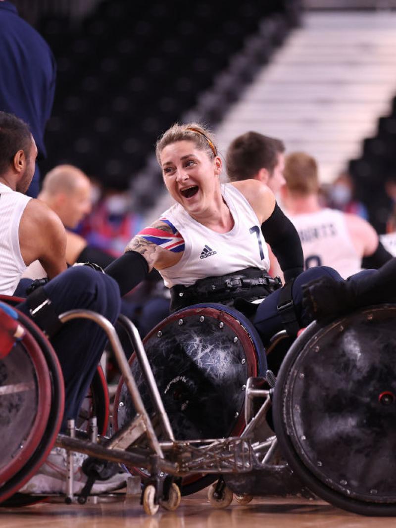 Kylie Grimes of Great Britain celebrates with teammates after defeating United States to win the Wheelchair Rugby gold at the Tokyo 2020 Paralympic Games.