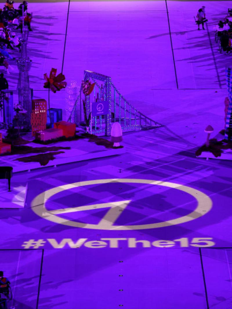 Wethe15 emblem lights up on the stage floor.