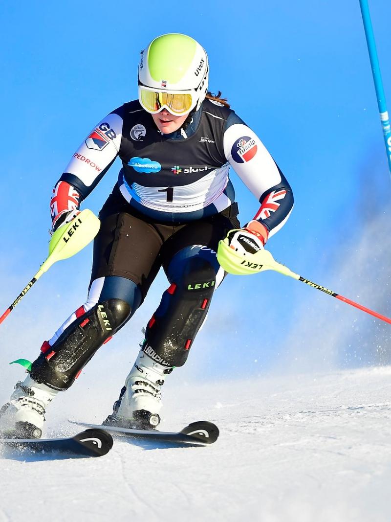 A female alpine skier in a slalom race