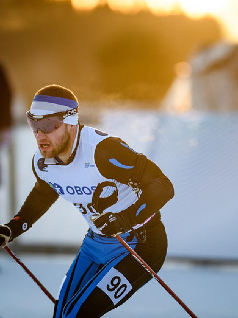 A male cross-country skier in a competition