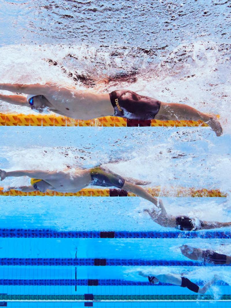 And underwater image of five men with disabilities in a swimming pool