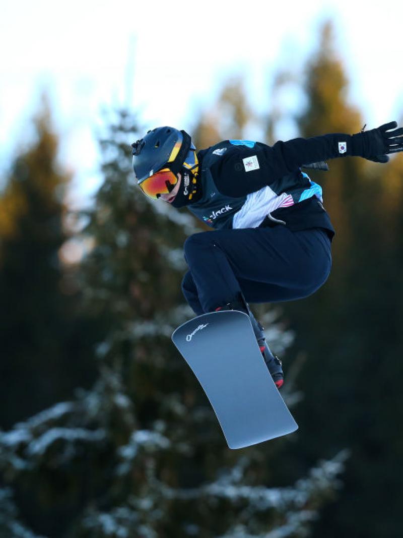 A male Para snowboarder during a competition 