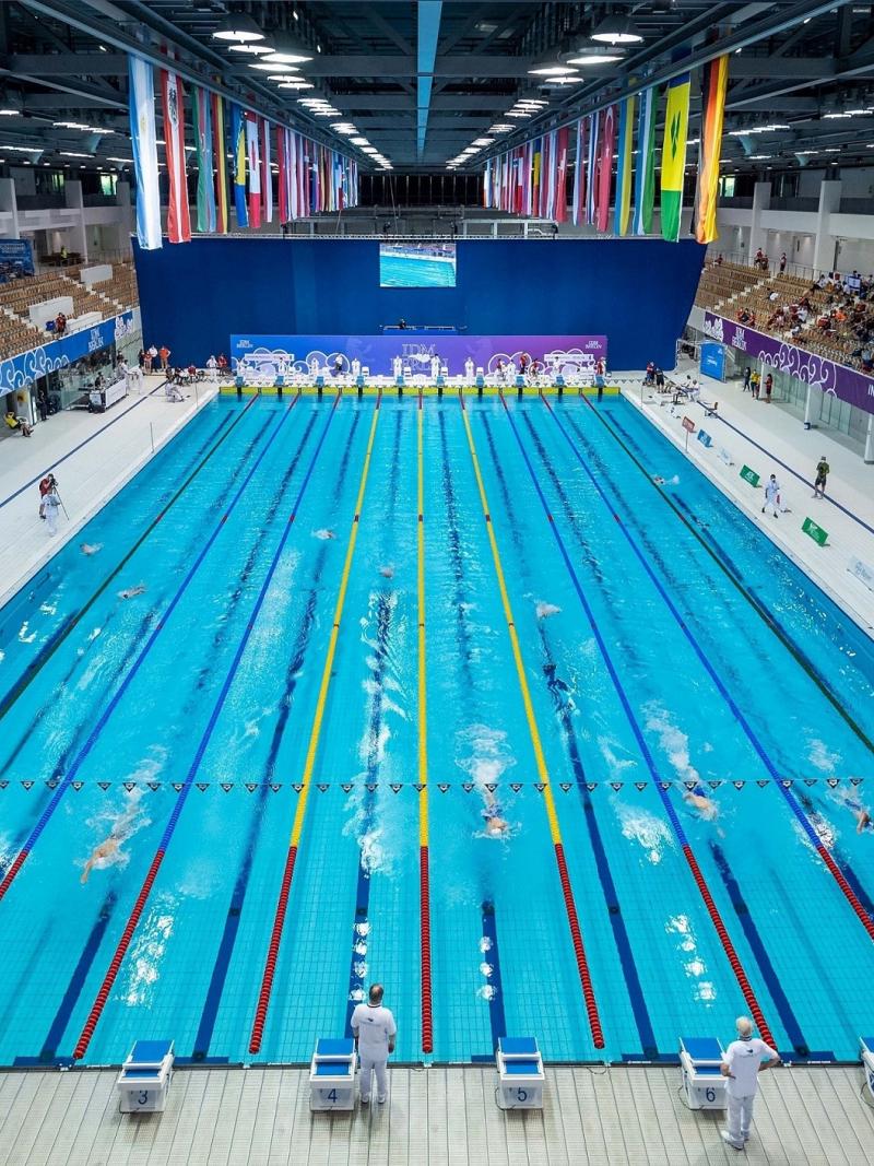 The view of a swimming pool complex with a swimming competition