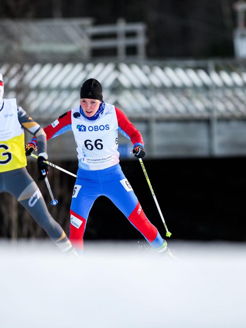 A female cross-country skier following her female guide