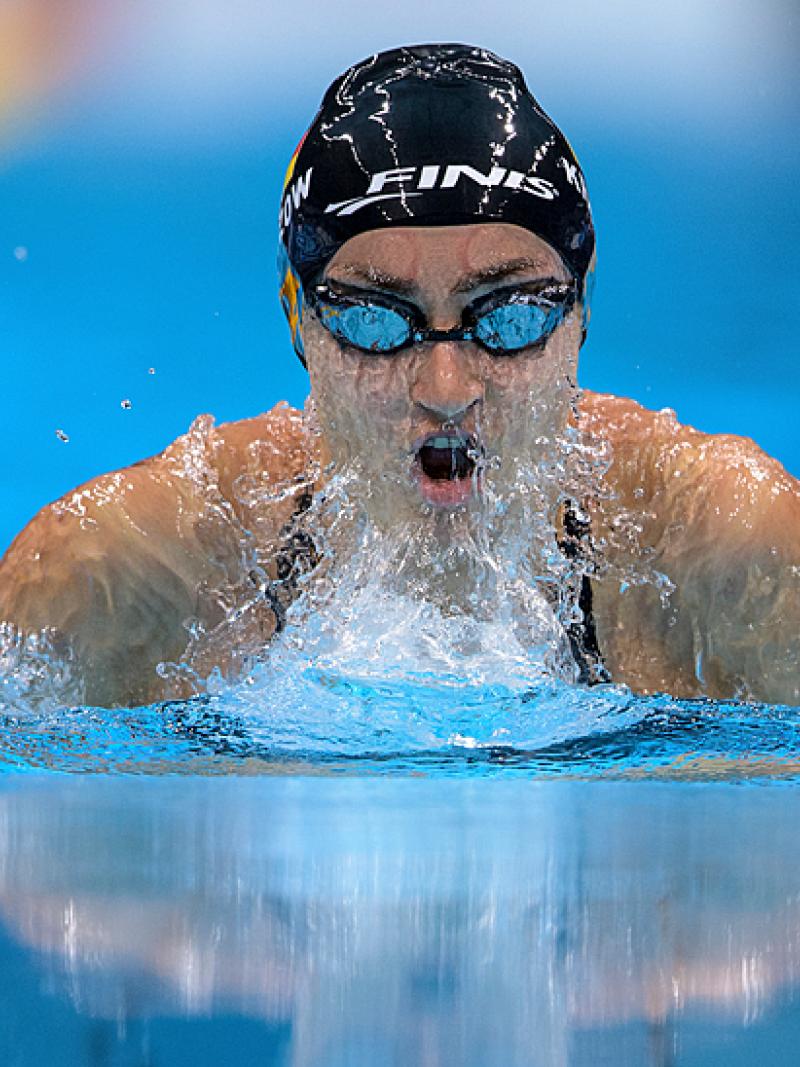A female Para swimming swimming breaststroke in a pool