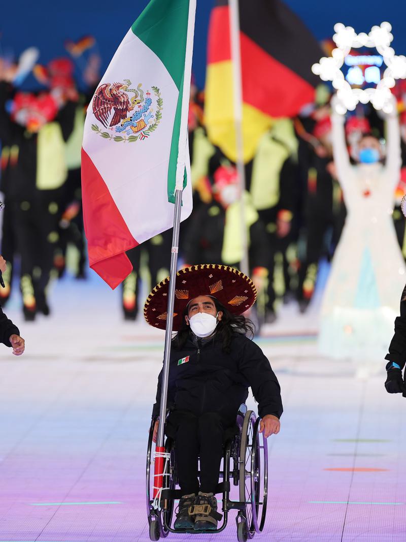 Arly Velasquez carries the Mexican flag at the Opening Ceremony of Beijing 2022