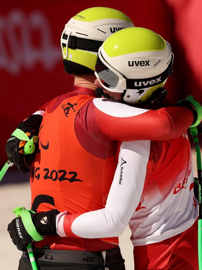 Johannes Aigner of Team Austria and his guide Matteo Fleischmann react after crossing the finish line