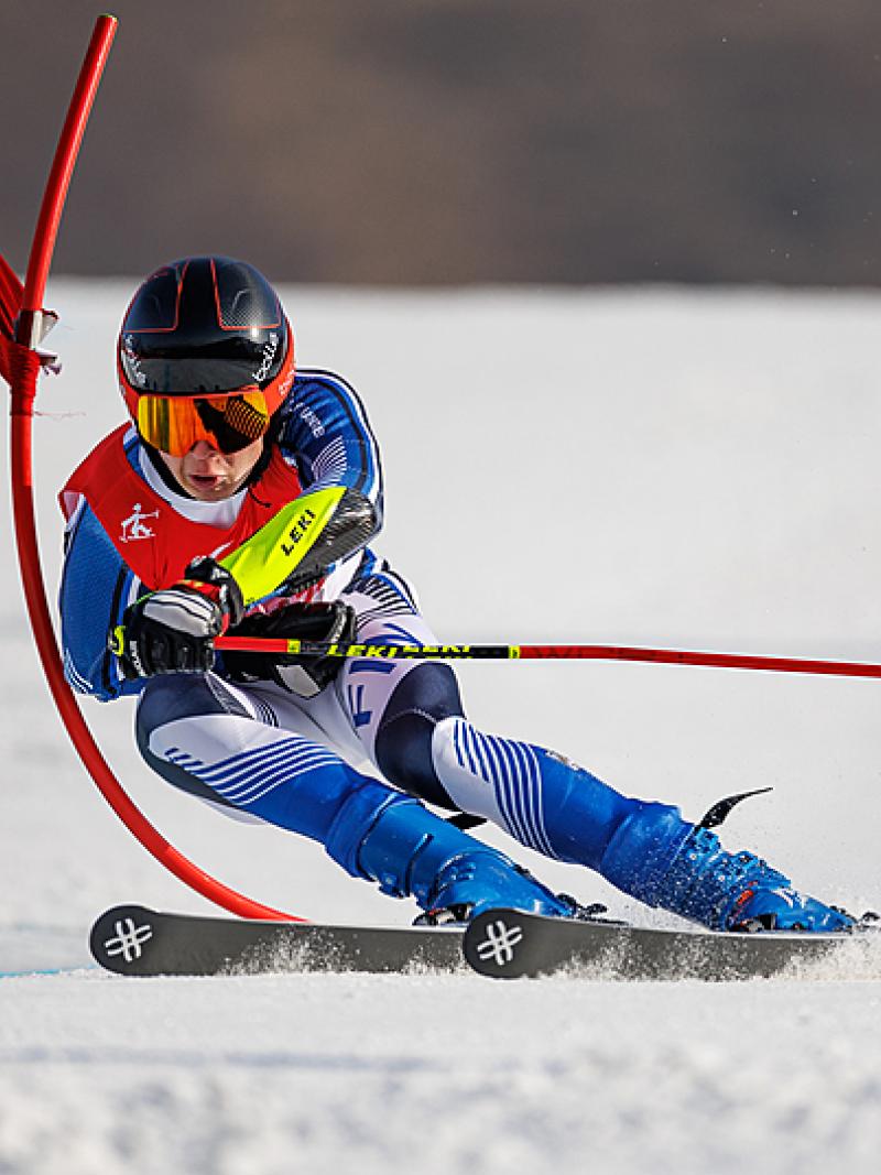 Finland's Santeri Kiiveri skis past a gate at Beijing 2022