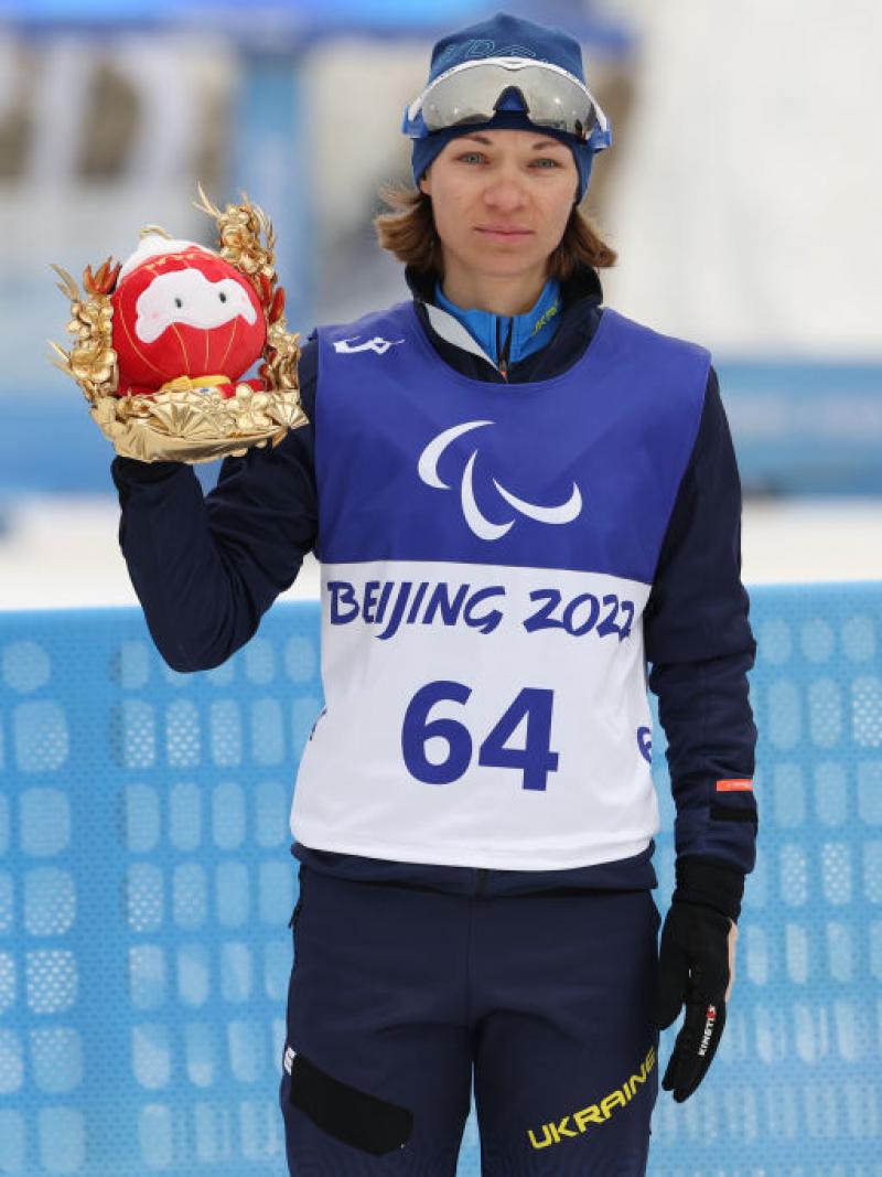 Liudmyla Liashenko of Ukraine poses after winning the Para Biathlon Women's Individual Standing at the Beijing 2022 Winter Paralympics.