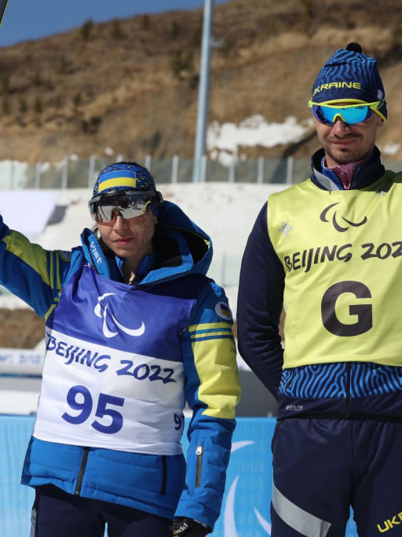 IN THE FORM OF HER LIFE: Gold medallist Oksana Shyshkova of Ukraine (left) with guide Andriy Marchenko celebrates after winning  the Para Cross-Country Skiing Women's Long Distance Classical Technique Vision Impaired at the Beijing 2022 Winter Paralympics.