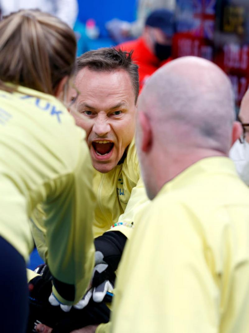 Ronny Persson #3 of Team Sweden gathers with his teammates for a cheer before competing in the Mixed Wheelchair Curling Round Robin Match between Great Britain and Sweden during Day Four of the Beijing 2022 Winter Paralympics at National Aquatics Centre