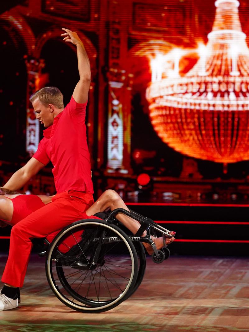 Philip Raabe leans over Birgit Skarstein, taking her and her wheelchair into a dip, as they perform a touching contemporary dance on Norway's SKal vi Danse.