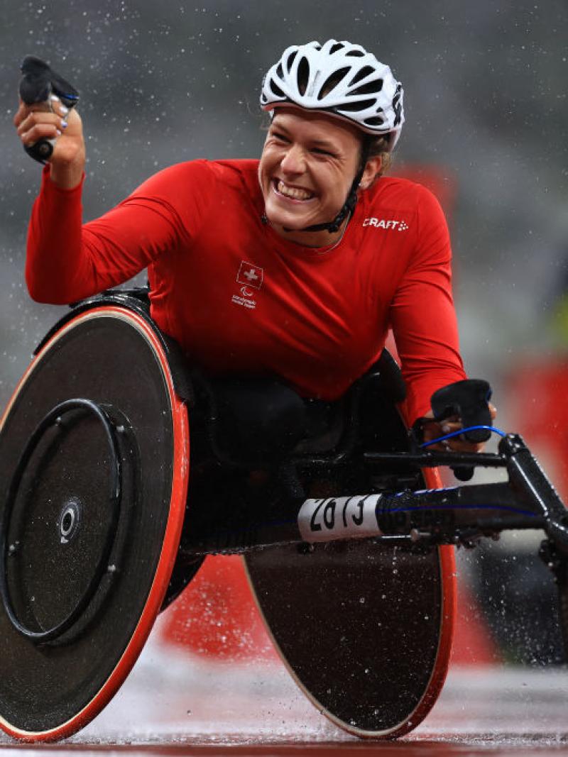 Image of a female Para Athletics athletes happy after she crosses the finish