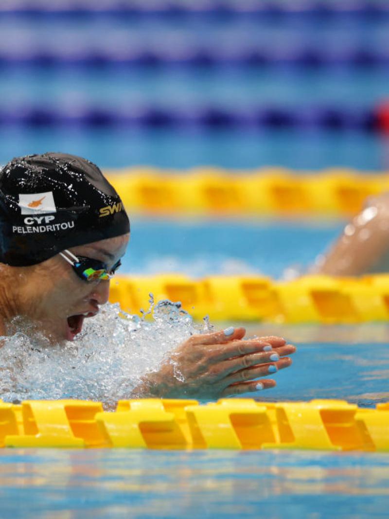 Two women swimming breaststroke in a pool