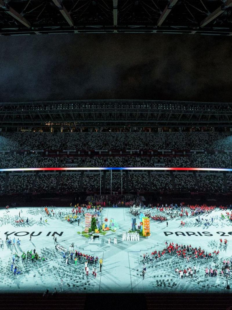 'See you in Paris 2024' is projected on the stadium ground during the Closing Ceremony of Tokyo 2020.