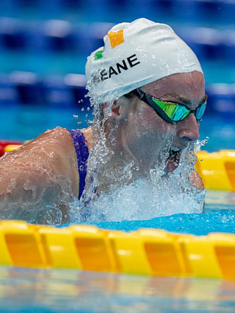 A female swimmer swimming breaststroke