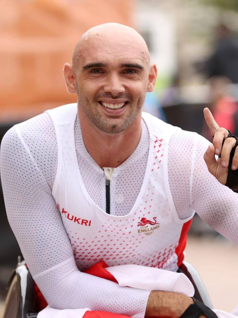England's Johnboy Smith crossed the finishing line in one hour 41.15 minutes for his first CWG gold.