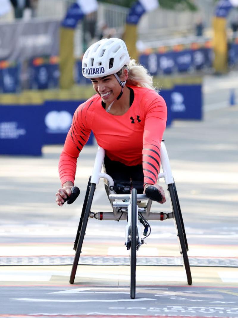 A female wheelchair racer crossing the finish line at the New York City Marathon