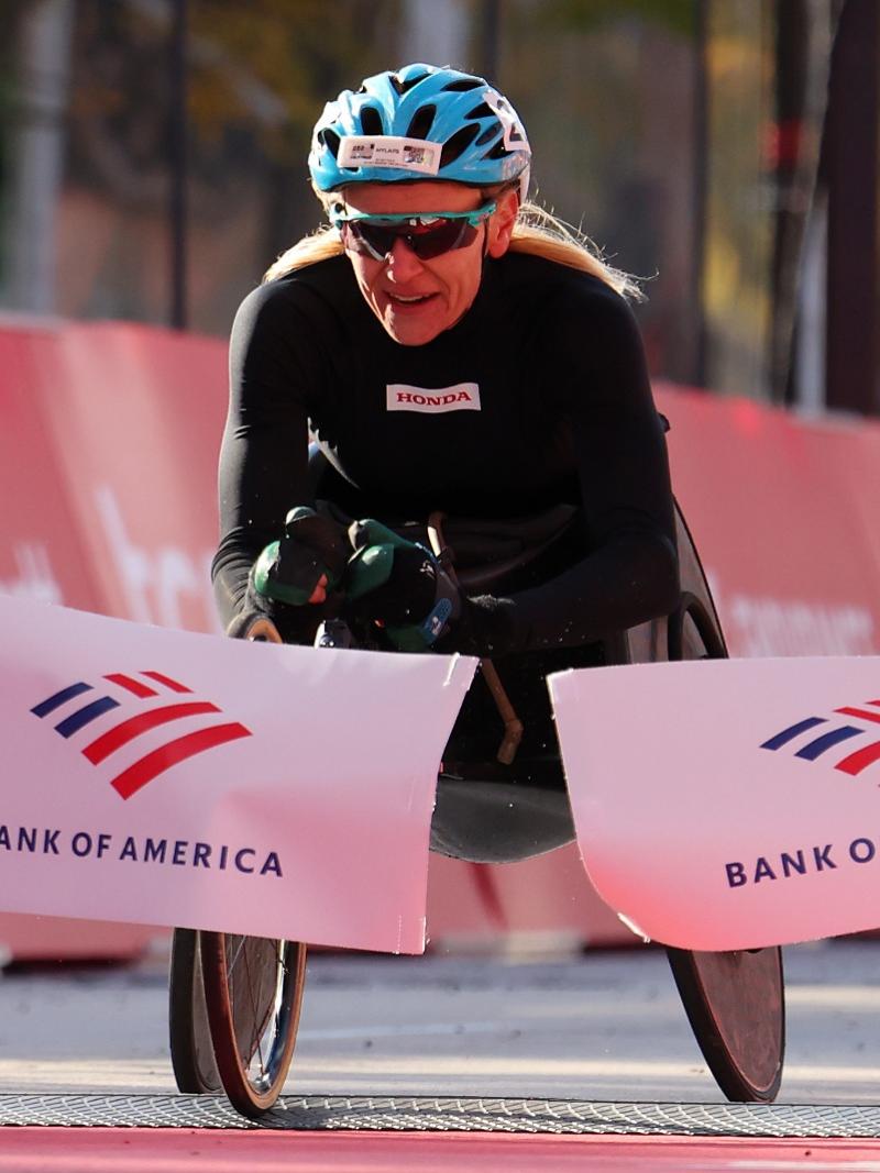 USA's Susannah Scaroni crosses the finish line in 1:45:48 to win the 2022 Chicago Marathon.