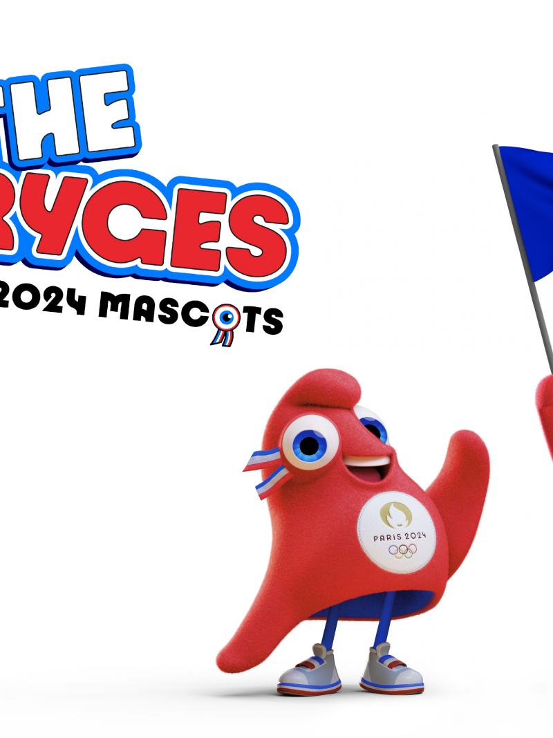 The Olympic Phryge waves while the Paralympic Phryge holds a French flag, with the words "The Phryges: The Paris 2024 Mascots" written in the background.